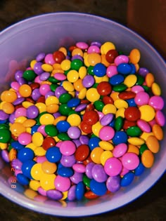 a bowl filled with lots of different colored candies