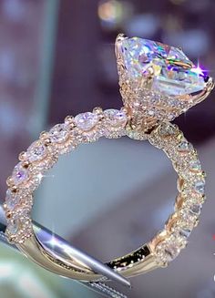 a close up of a diamond ring on display