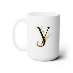 a white coffee mug with the letter v on it