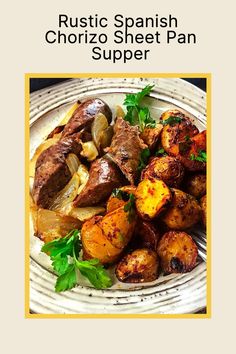 a white plate topped with potatoes and meat next to green leafy garnish