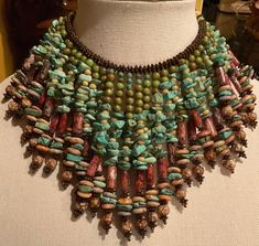 This is another Rare Find. I purchased this master piece in the 90's. It's a multi-strand Bib Collar necklace. Each strand is layered with different shades of turquoise with natural Jasper beads. It has 31 strings of stones. This is a choker collar necklace. It measures 14 inches from clasp to clasp (width). The length is 11 inches from closed clasp to the bottom of the center front strand. It's truly a beauty. I believe the clasp has been replaced. Other than that, it's in mint condition. See Photos. Boho Choker Necklace, Diy Jewellery Designs, Beach Jewelry Boho, Sculptural Jewelry, Recycled Sweater, Queen Jewelry, Choker Collar Necklace, Pandora Avatar, Bib Collar