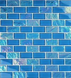 blue glass mosaic tile in the shape of a wave pattern on a wall or floor