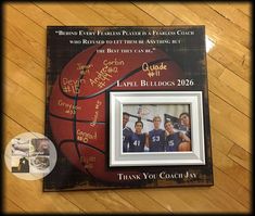 an autographed basketball is on the floor next to a framed photo and other memorabilia