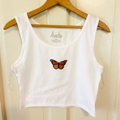 Nwot White Crop Top Festival Orange Butterfly Smoke Free Home No Stains Or Snags Women’s Size Large Very Stretchy And Soft 95% Cotton 5% Spandex Aveto Brand Fitted Tank T-shirt For Summer, Fitted Crew Neck Tank Top For Summer, White Crew Neck Tank Top For Spring, White Fitted Tank T-shirt, White Basic Crop Top For Summer, Basic White Crop Top For Summer, Basic Graphic Print Crop Top For Summer, White Tank T-shirt For Spring, Butterfly Crop Top