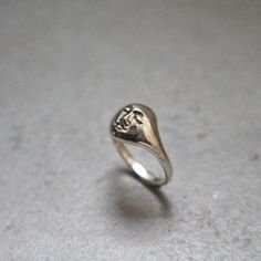 Moonface signet ring for women or for men. Size: made to order, please check your size with a proper jewelry tool or in a jewelry store. This ring is made in silver 925, but you can order it in 18K gold.  You can find some other rings from the same collection here:  https://www.etsy.com/listing/888180722/moon-face-ring-signet-unisex-ring?ref=shop_home_active_35&frs=1 The face necklace : https://www.etsy.com/listing/900846011/silver-face-pendant-moon-necklace?ref=shop_home_active_4&pro=1&frs=1 This ring is available also in 18K gold. Depending on your size, the price will be between 732- 850 euros. Don't hesitate to contact me. Diy Ring For Men, Moon Face Ring, Timeless Silver Initial Ring, Formal White Gold Skull Ring In Sterling Silver, Classic Sterling Silver Skull Ring With Polished Finish, Symbolic Sterling Silver Signet Ring For Wedding, Wedding Symbolic Sterling Silver Signet Ring, Timeless White Gold Sterling Silver Signet Ring, Classic Silver Skull Ring With Polished Finish