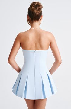 This mini IS the moment. Cut from our premium crepe fabric, Bryony has a strapless neckline and is fitted through the bust and waist for a super flattering fit. It flares gently at the skirt with box pleat detailing. Pair with cute loafers for daytime chic or heeled mules and minimal jewellery to dress her up. 



Colour: Blue.

Premium non-stretch crepe.

Fully lined.

Strapless neckline.

Fitted on bust and waist.

Panelled seam detail.

Box pleat skirt.

Invisible zipper to back.

Mini length.

Model is an XS and is wearing an XS.

 Size: XS, S, M, L, XL, XXL Light Blue Mini Dress, Slippers Outfit, Midi Dress Wedding Guest, Hoco Inspo, Split Long Dress, Minimal Jewellery, Box Pleat Skirt, Rush Dresses, Pleat Skirt