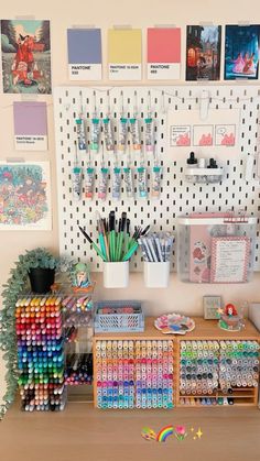 there are many different items on the table in this room, including pens and pencils