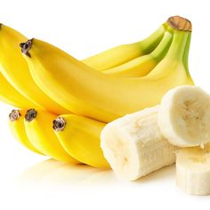 several bananas and two slices of banana peels next to each other on a white background