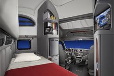 the interior of an airplane with bed, refrigerator and television in each room on either side