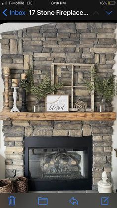 a living room with a stone fireplace and mantle