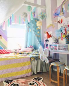 a child's bedroom decorated in pastel colors