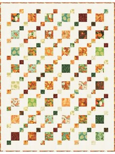 an orange and green quilt with squares in the center, on top of it is a white background