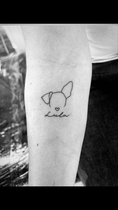 a black and white photo of a dog's head with the word love on it