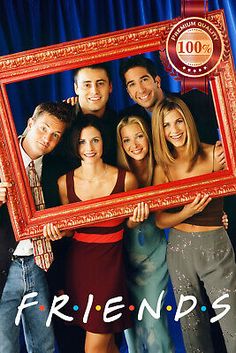 the friends are posing for a picture together in front of a blue curtain and red frame