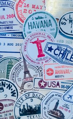 many different colored stickers are on the table together, including one for each country