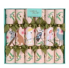 twelve pink candles in a gift box with green ribbon and australian animals on the front