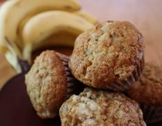 some muffins and bananas on a black plate