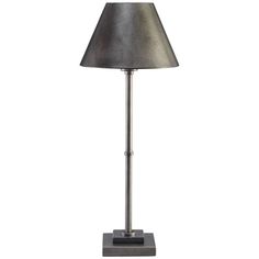 a lamp that is sitting on top of a metal stand with a black shade over it