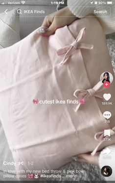 someone is holding a pink pillow with bows on it and the text reads, cutest ikea finds