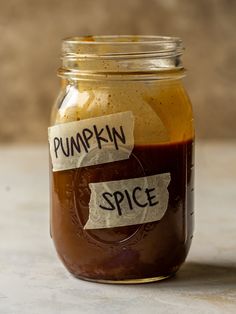 a jar filled with pumpkin spice sitting on top of a table