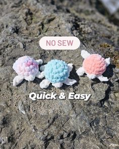 three small stuffed animals sitting on top of a rocky surface next to a sign that says no sew quick and easy