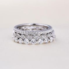 a wedding ring with three rows of diamonds