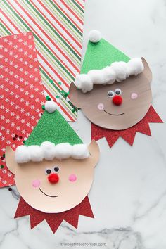 two paper christmas hats on top of each other