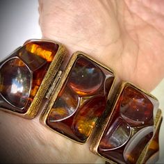 Wow Vintage Chunky Bracelet Features Resin Organically Shaped Semi Transparent Rootbeer Or Tortoise Shell Hued Stones In Rectangular Gold Tone Engraved Style Floral Backed Settings. Rectangles Are Hinged And Linked Together. Bracelet Secures With A Gold Over Clasp. Runway Unique Showstopper! Hard To Fine Retro Bracelet. Measures 7.5" End To End Each Rectangle Measures About 1.5" Long X 7/8" Wide And Sits Almost 1" High Bold Statement Piece! Retro Bracelet, Vintage Runway, Chunky Bracelet, Chunky Bracelets, Semi Transparent, Root Beer, Tortoise Shell, Unique Colors, Brown Gold