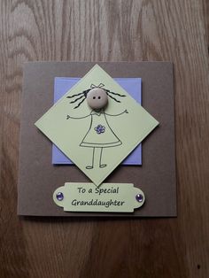 a card with a button on it that says to a special granddaughter