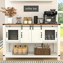 a coffee bar with white cabinets and baskets