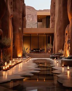 candles are lit in the middle of an outdoor courtyard