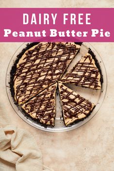 a pie with chocolate drizzled on it and the words dairy free peanut butter pie