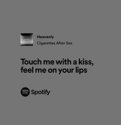 an ad for spotify with the caption touch me with a kiss, feel me on your lips