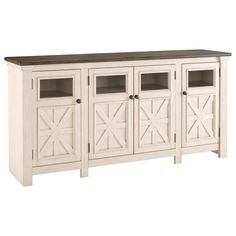 an entertainment center with doors and drawers