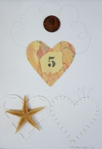 a paper heart and starfish on a white background with the number five cut out