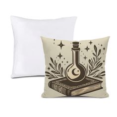 two pillows with an image of a book and a flask on top of it