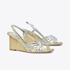 Flattering and comfortable, the multi-strap espadrille wedge sandal features a woven upper and a slingback ankle strap. Crafted in crinkled metallic leather and set on a jute platform wedge, the warm-weather silhouette dresses up or down. Tory Burch Espadrilles, Silver Wedges, Espadrille Wedge, Footwear Design Women, Designer Sandals, Platform Wedge, Espadrille Shoes, Senior Year, Wedge Sandal