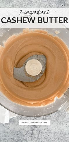 a food processor with peanut butter in it and the words, 2 ingredient cashew butter