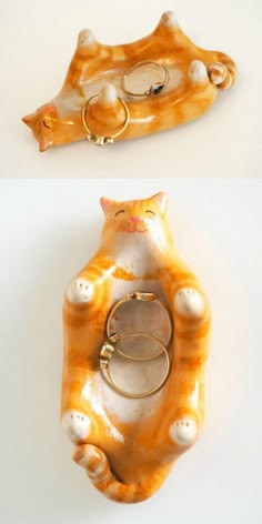 an orange and white cat shaped object with two rings on it's back end