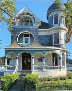 an old victorian style house with turrets and arched windows