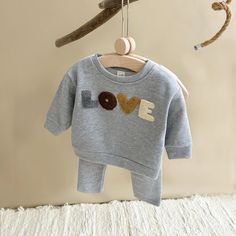 Wrap your little one in cozy comfort with our 'LOVE' Long-Sleeve Sweatshirt & Pants Set, perfect for toddlers aged 1-3 years! This unisex baby outfit is ideal for autumn, featuring a charming letter pattern that adds a sweet touch to their seasonal wardrobe. 🍂 Made from a soft blend of 65% cotton and 35% polyester, the broadcloth fabric ensures warmth and durability. The long sleeves and regular fit provide maximum comfort, while the pullover closure and O-neck collar make dressing a breeze. De Letter Love, Love Embroidery, Baby Boy Clothes Newborn, Baby Girl Boy, Newborn Baby Girl, Romper Outfit, Girls Blouse, Baby Outfit, Cozy Outfit