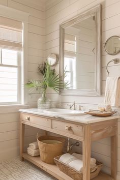 a bathroom with two sinks and mirrors on the wall