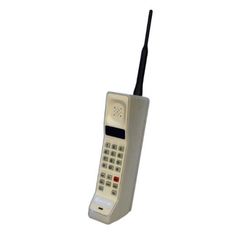 an old style cell phone sitting on top of a white surface with a black cord