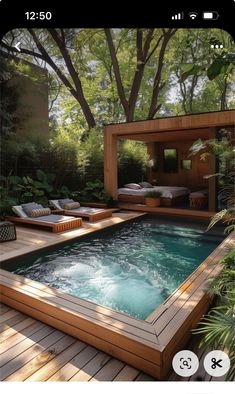 an outdoor hot tub in the middle of a wooden deck