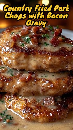 two pork chops with bacon gravy on a plate