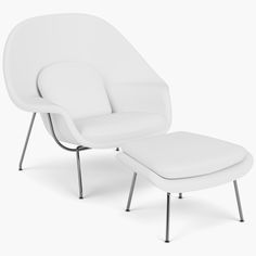 a white chair and ottoman sitting next to each other