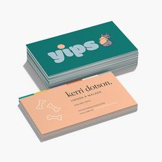 two business cards with dogs on them sitting next to each other in front of a white background