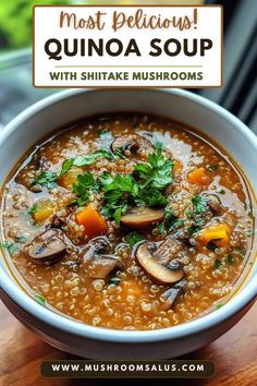 a bowl of soup with mushrooms and greens in it on top of a wooden table