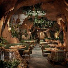 the interior of a restaurant with plants growing on the walls and tables in the middle