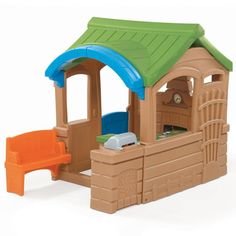 a play house with a slide and sandpit in the middle, on a white background